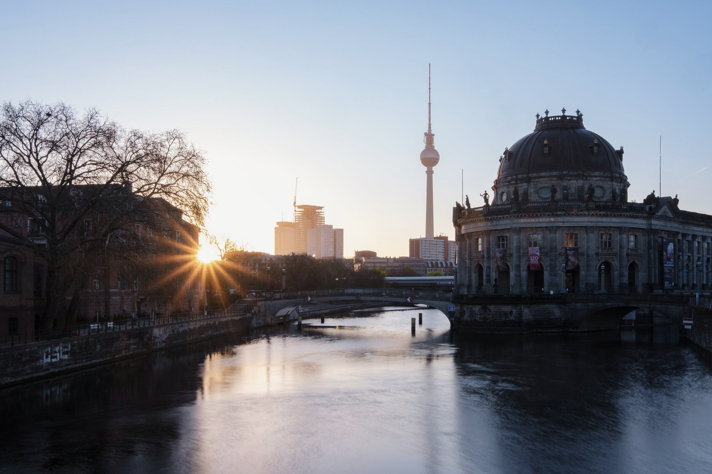 The Bode-Museum on Museum Island at sunrise, seen across the Spree.