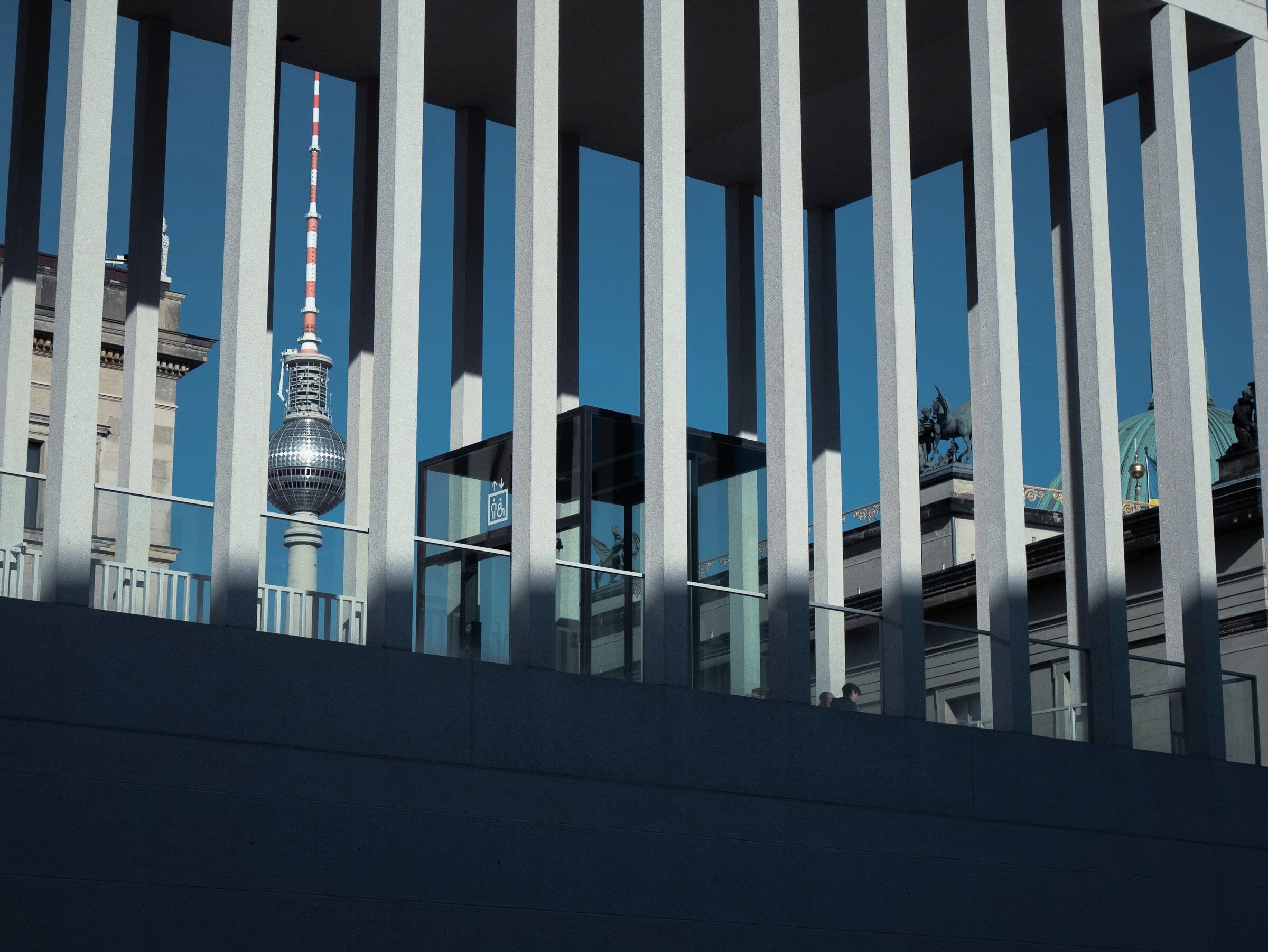 The James Simon Galerie columns framing the television tower.